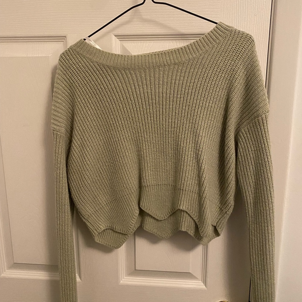 green knitted sweater